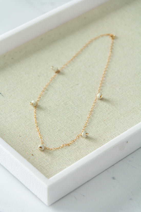 The Neima Tiny Bead Drop Necklace